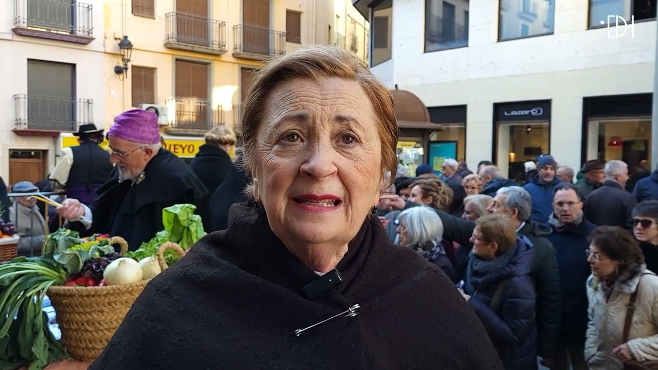 Reparto de caretas y candelas en la feria de Barbastro