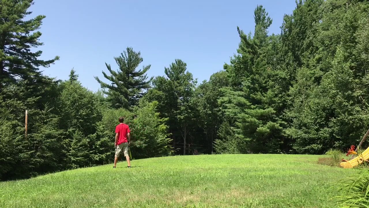 Hitting golf balls with a baseball bat