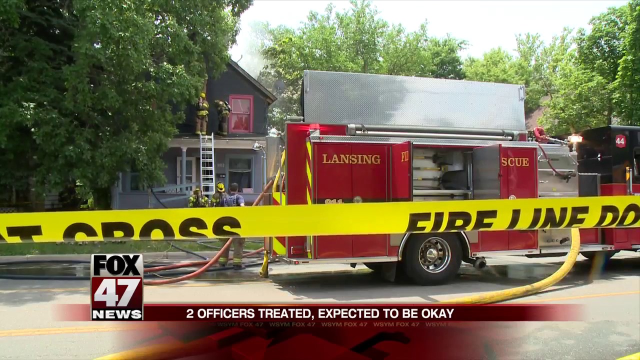 Crews battle house fire in Lansing