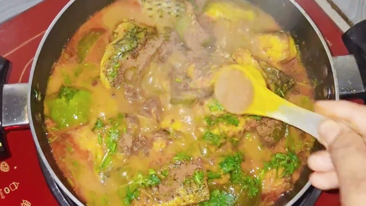 তেলাপিয়া মাছ দিয়ে বেগুন রান্না।
