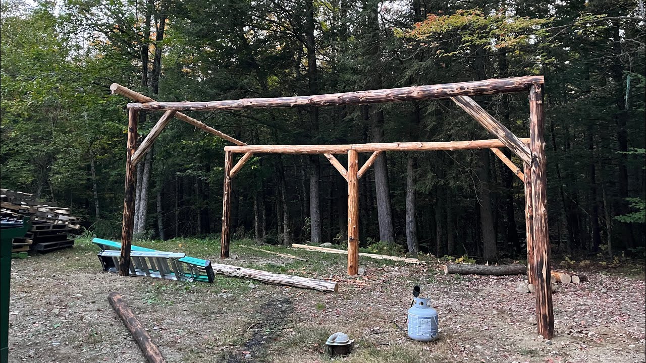 Setting the ridge beams and braces for the FREE pole barn using Mother Nature!!