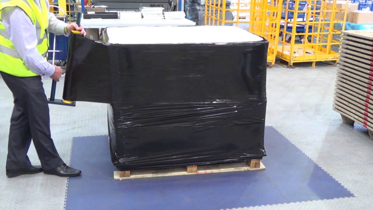 Demonstrating Black Security and Blue Tint Pallet Wrap