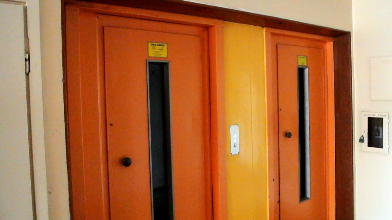 2x 1970s ZREMB traction elevators without inner doors @ Maltańska 6, Warsaw, Poland