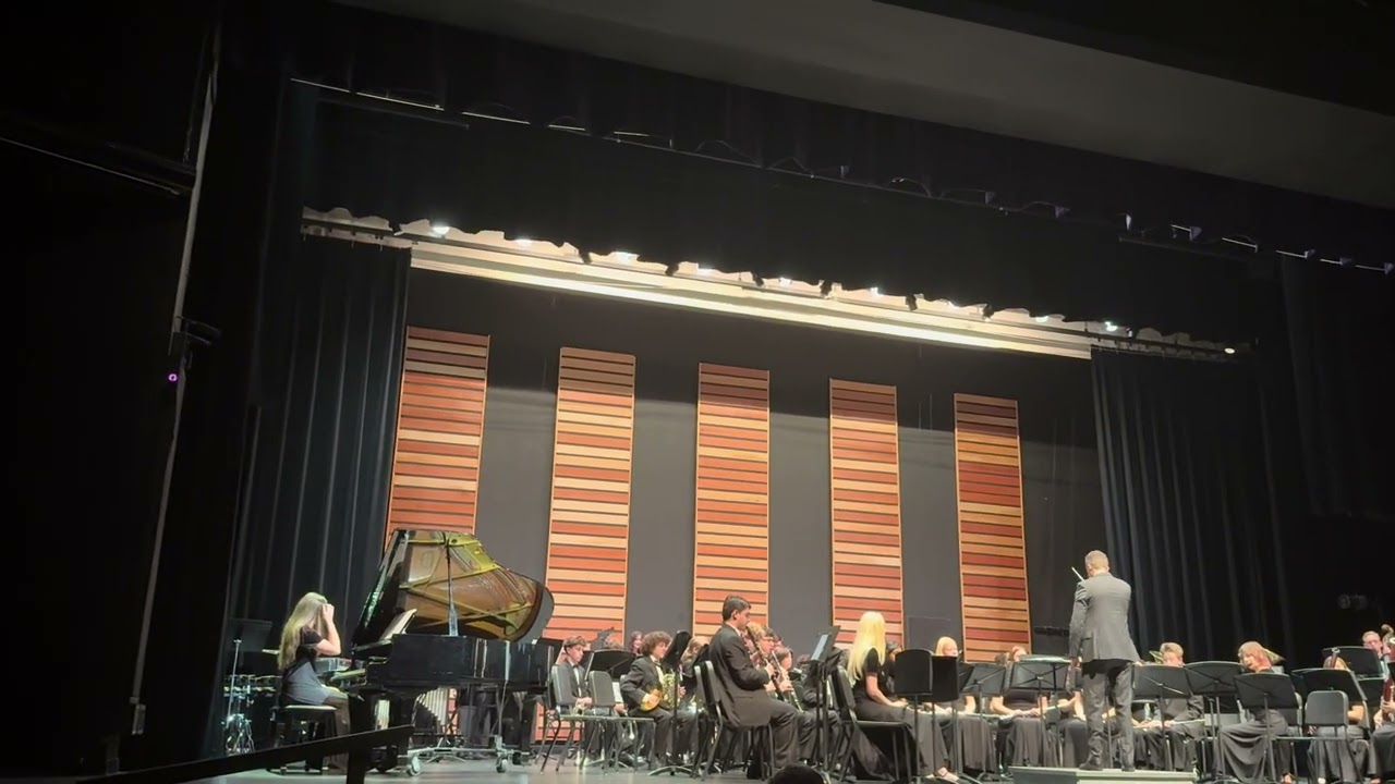 Jw Mitchell wind ensemble play Tam O’Shanter Overture at pre mpa 