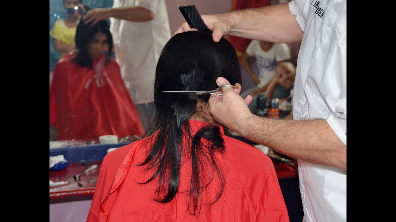 Girl long to short hair cut