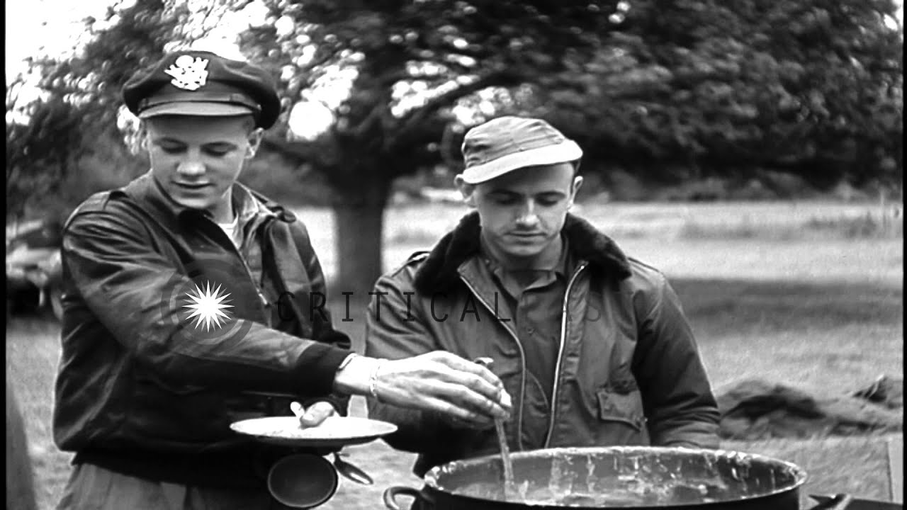United States 9th Air Force in France; Army airmen in chow line and serving food. HD Stock Footage