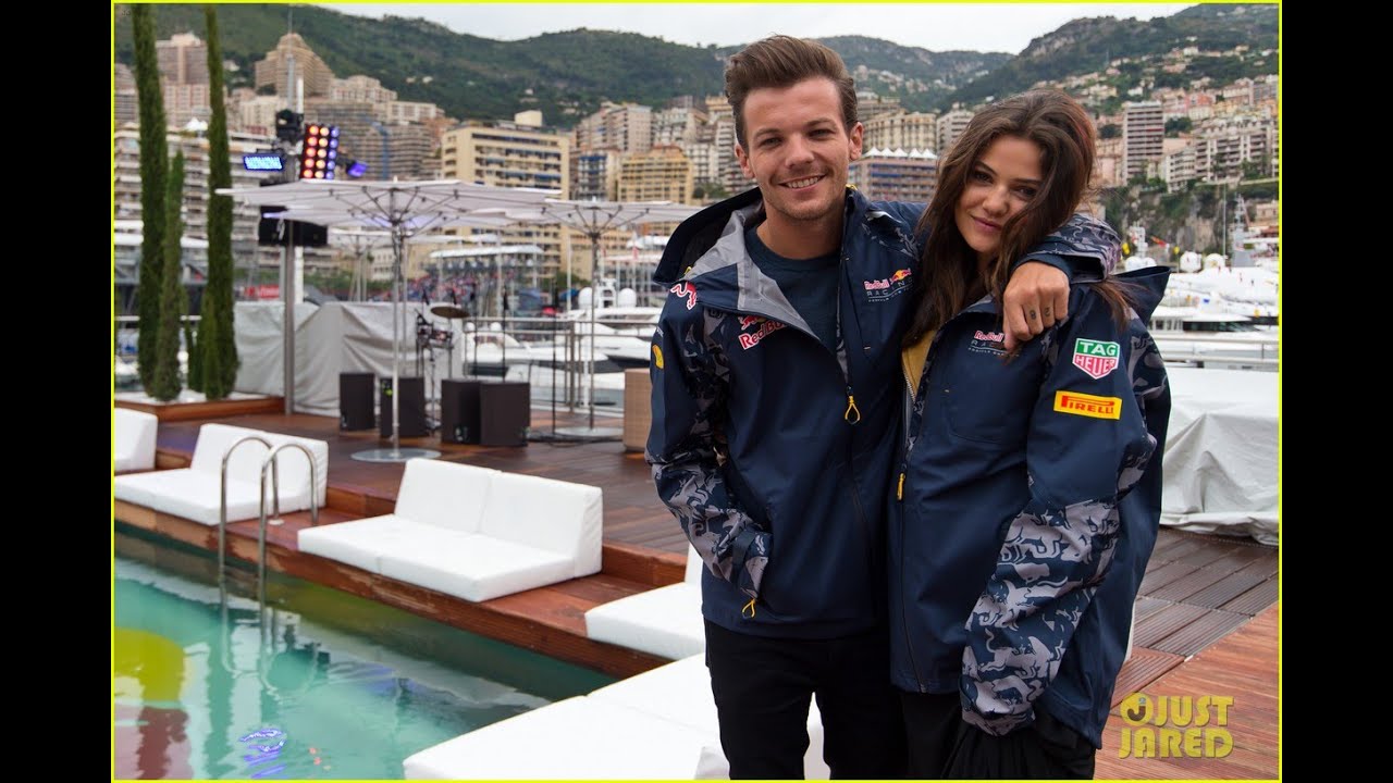 Louis Tomlinson Braves the Rain With Danielle Campbell for F1 Grand Prix