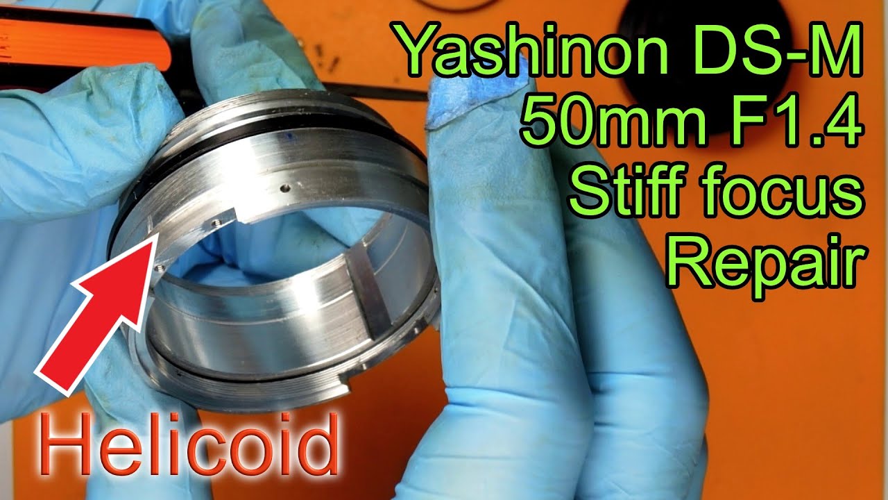 Repairing stiff focus on Yashinon DS-M 50mm F1.4 lens.