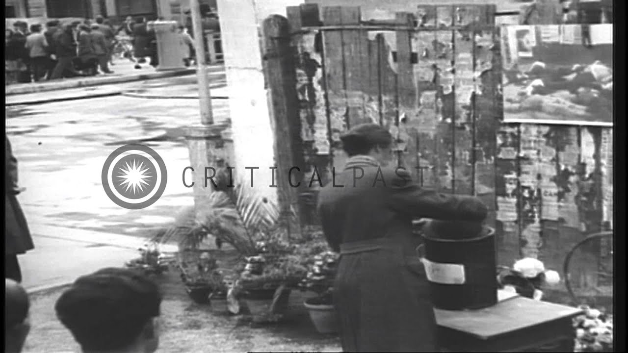 People look at the point where Mussolini and others were hanged after death in Mi...HD Stock Footage