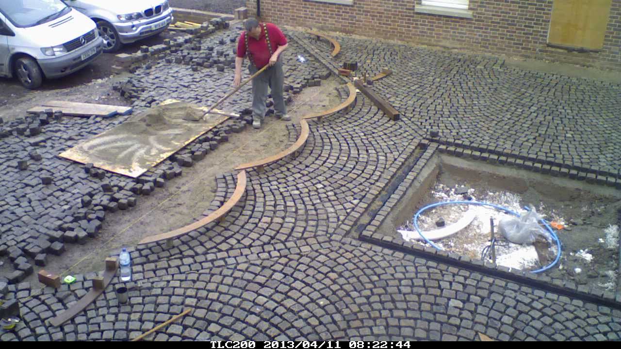 laying reclaimed granite setts for driveway and courtyard to French style