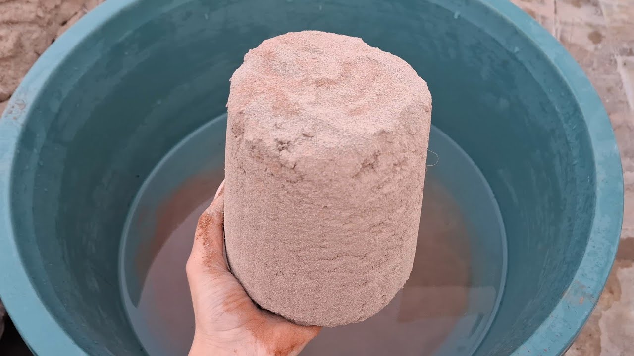 New video Soft brown sand water crumbling satisfying