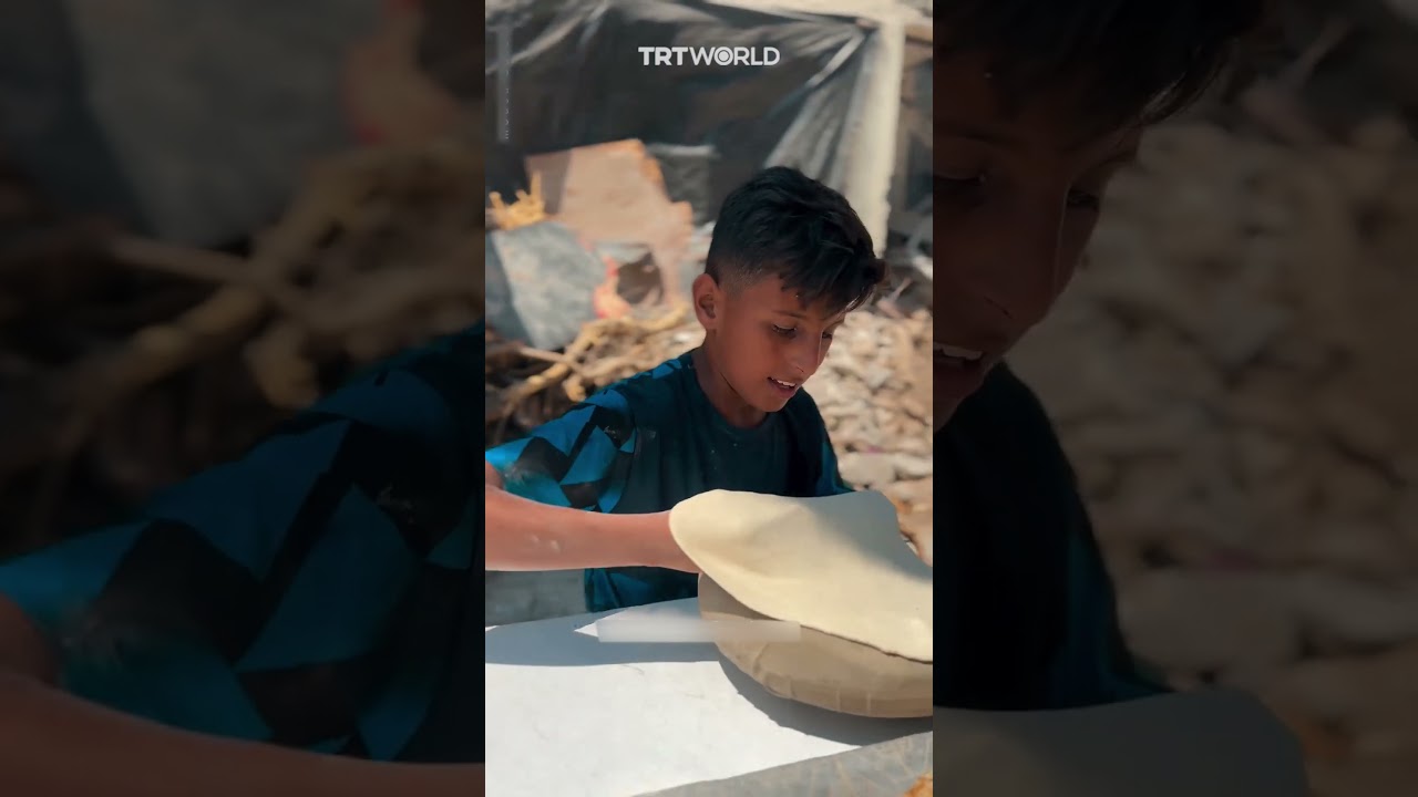 Palestinian child recites Quran while preparing bread