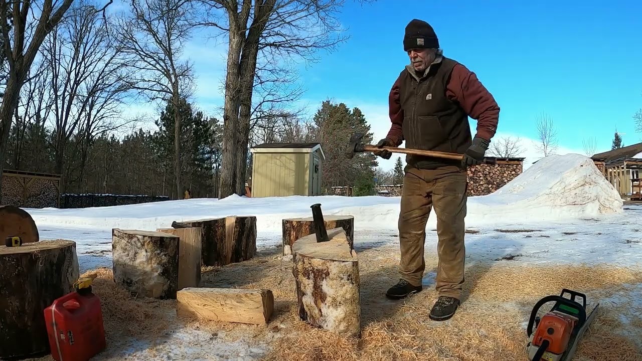 Quartering large pine rounds using a maul and steel wedges