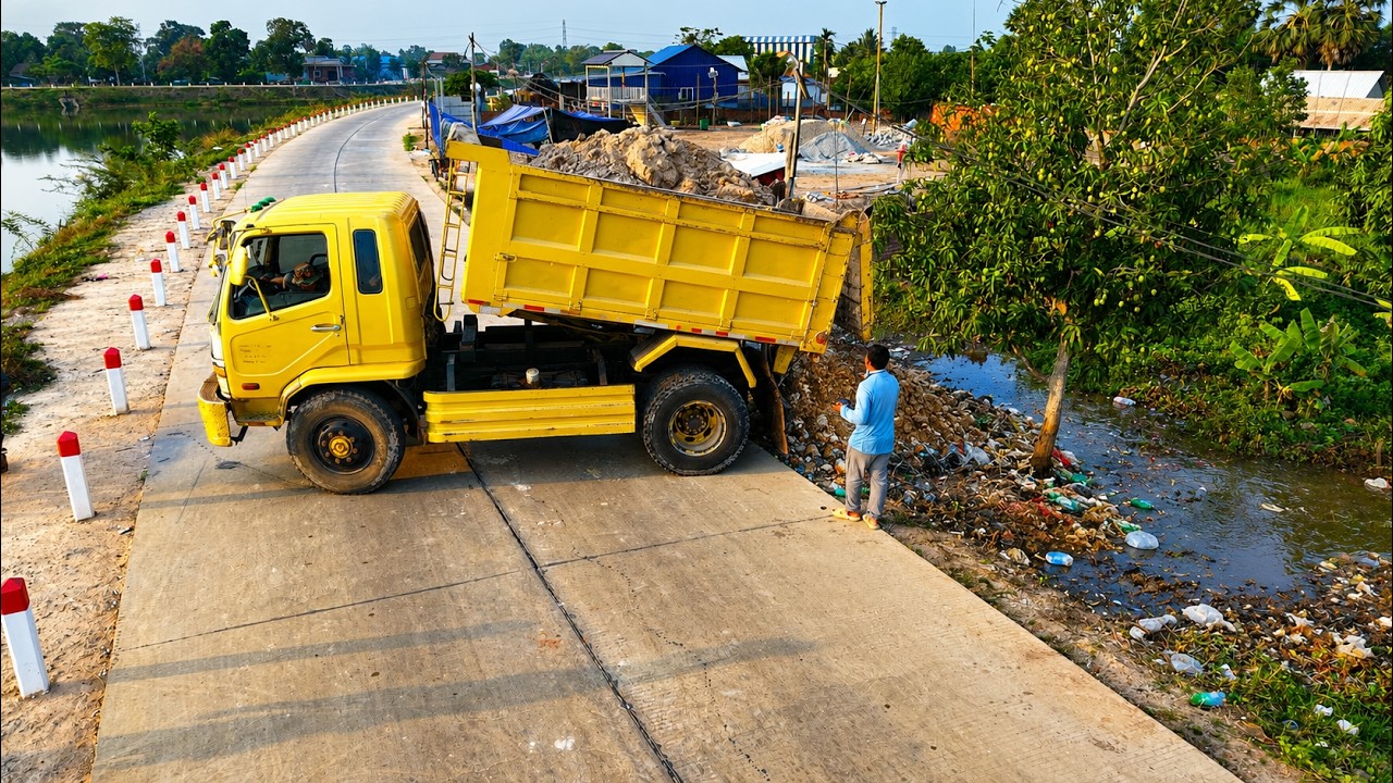 Complete100% Clear Garbage & Landfill On Lowland by Dump Truck Unloading Soil, Bulldozer Komat'su D2