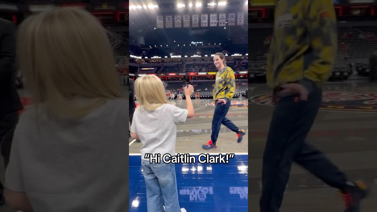 Caitlin Clark with a young fan