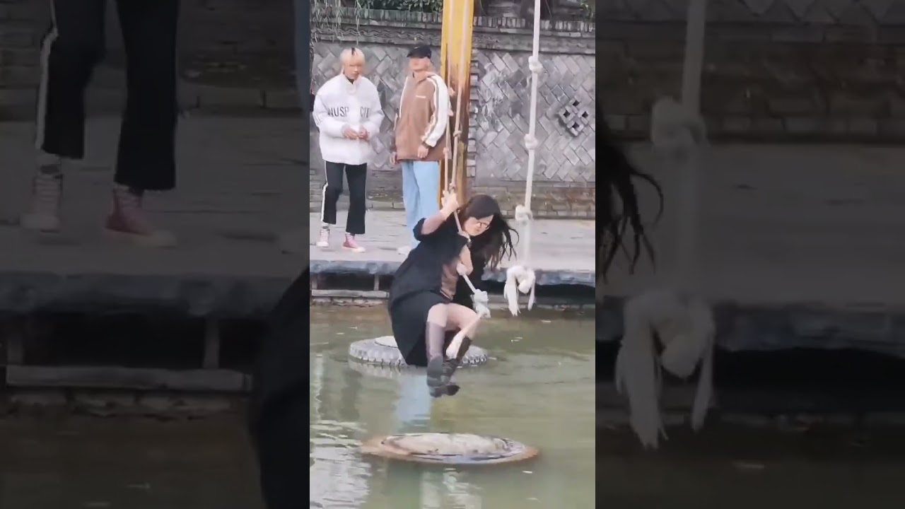 Two Chinese woman wet boots playing slings on water mp4