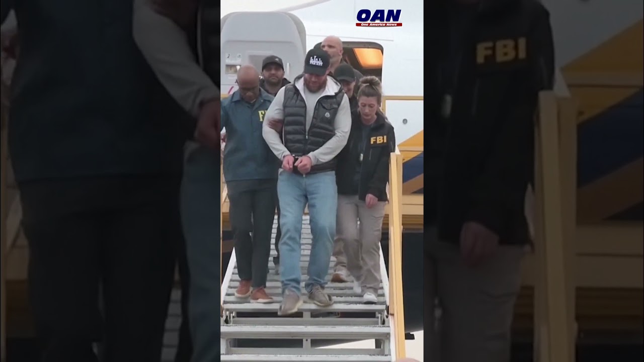 Ryan Wedding escorted by FBI agents