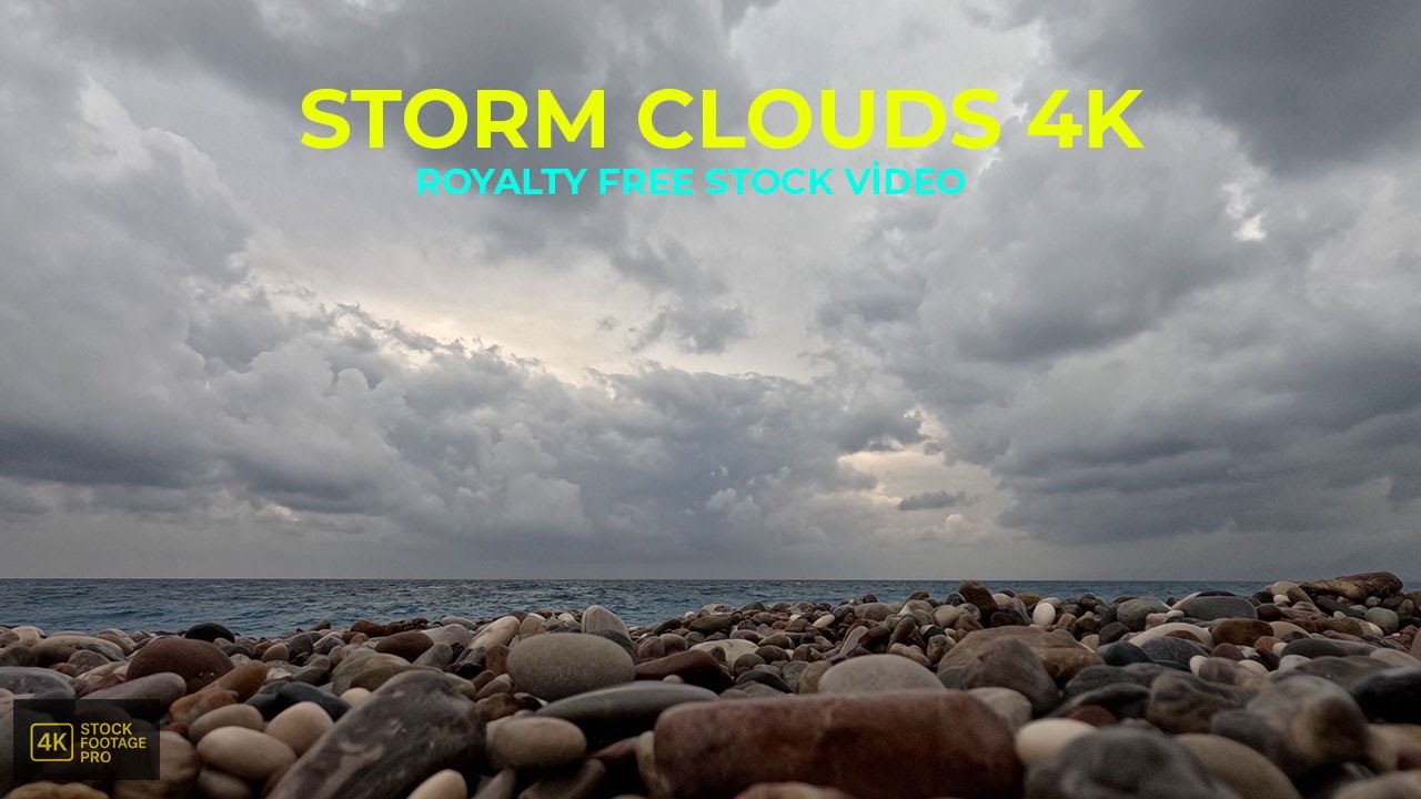 Rain Clouds Moving Over a Pebble Beach | 4K Timelapse Seascape