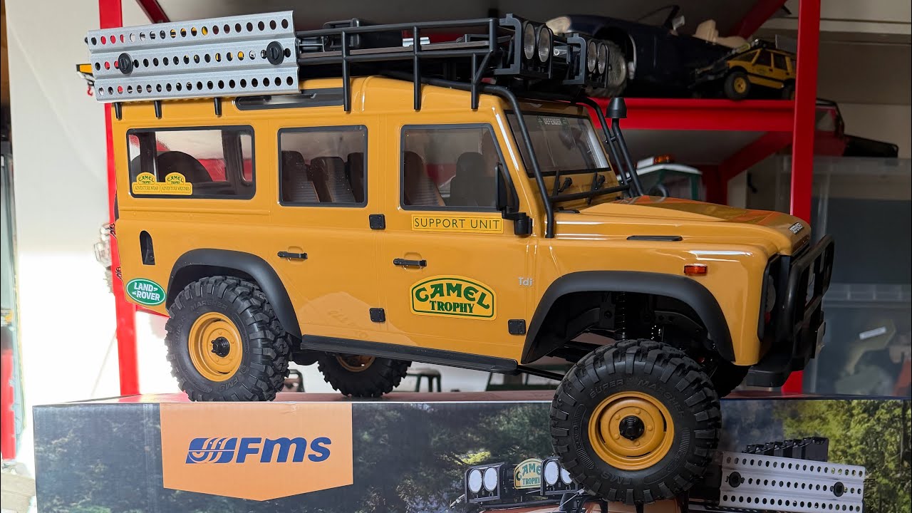 FMS FCX10 Land Rover DEFENDER Camel Trophy unboxing and first impressions. 