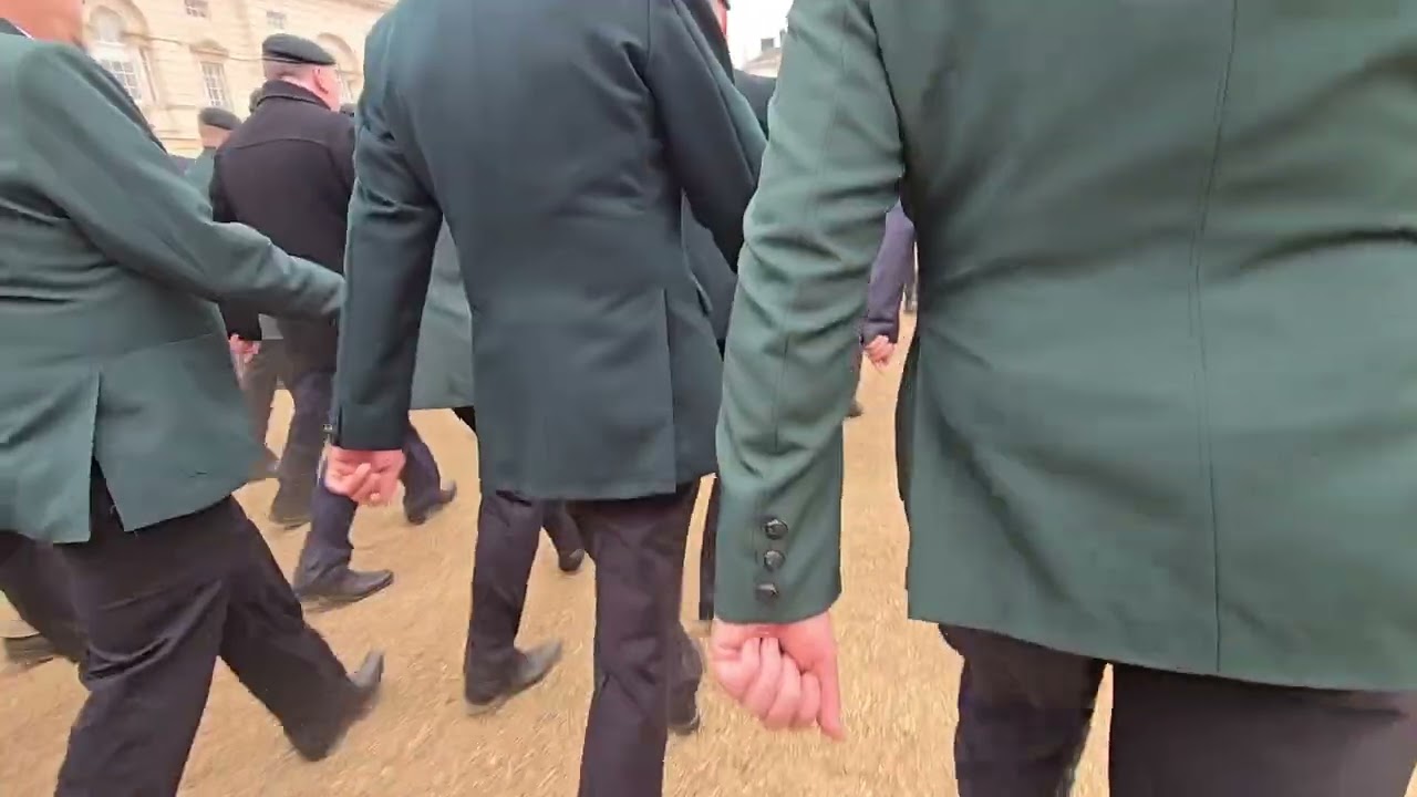 Riflemen of the Royal Green Jackets marching to a halt after Remembrance 2024