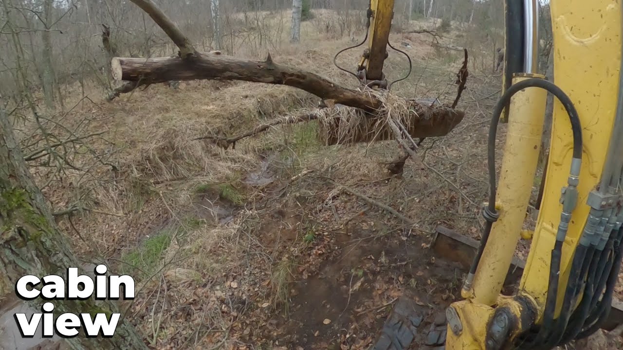 Desilting And Cleaning The Drainage Ditch With Excavator - Cabin View