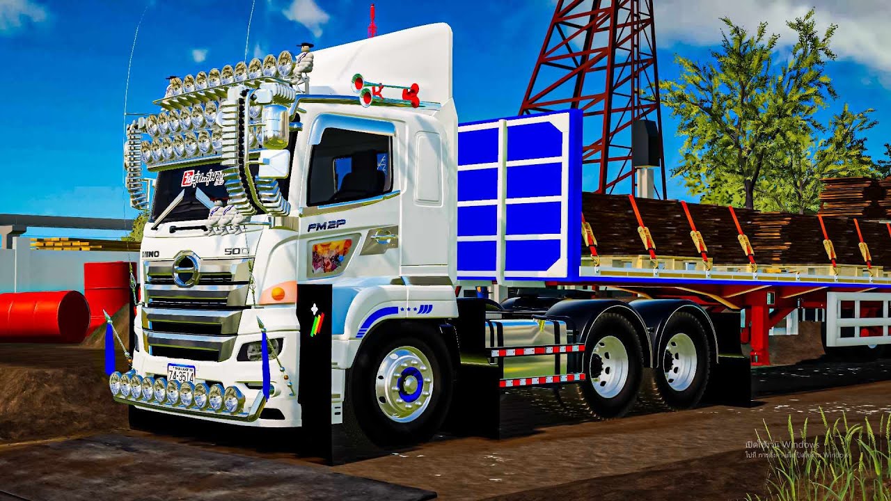 หัวลากโก๋เสกสายบรรเทิงวิ่งหางพื้นเรียบขนเหล็กในไซต์งาน Farming simulator 19