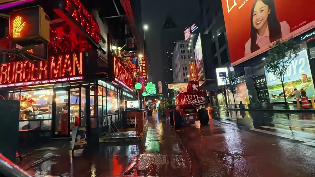 Rainy evening walk through 42nd st Times Square NYC 