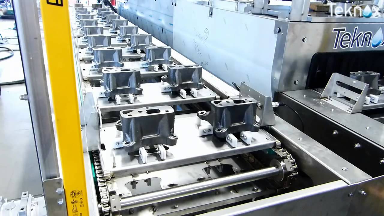 TUNNEL: for automotive parts, with pick and place and return conveyor