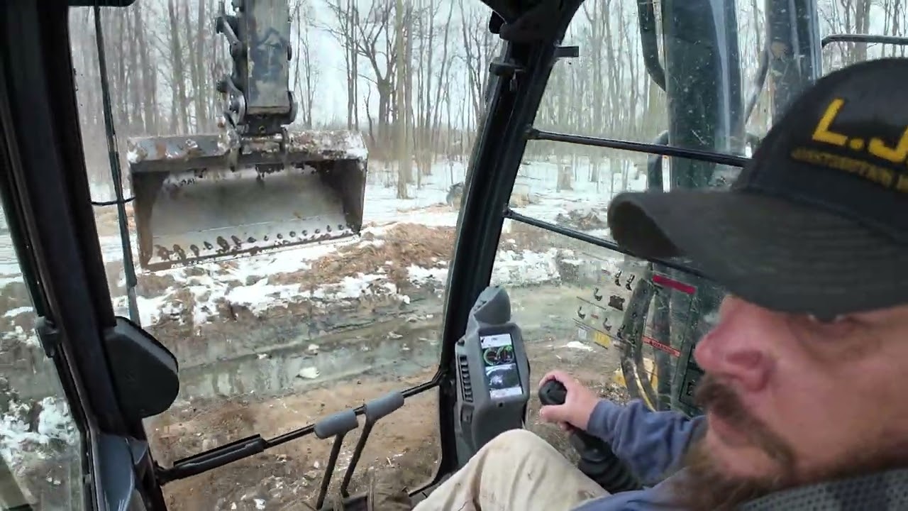 Inside of a excavator view digging a ditch 