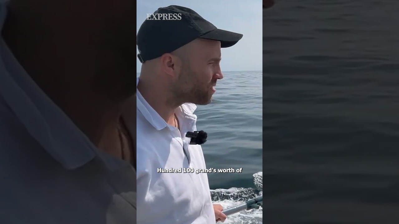 Moment migrant boat nearly collides with French shipping vessel