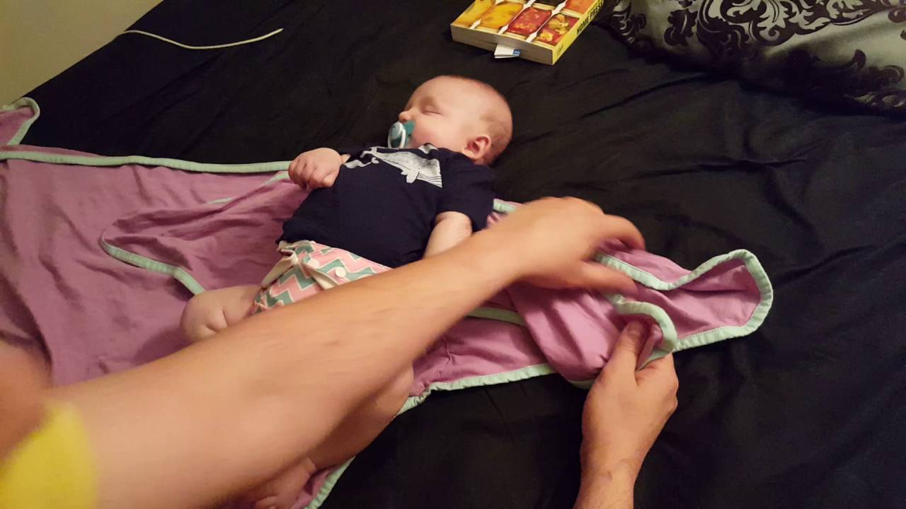 Wrapping up Caius in Miracle Swaddle Blanket