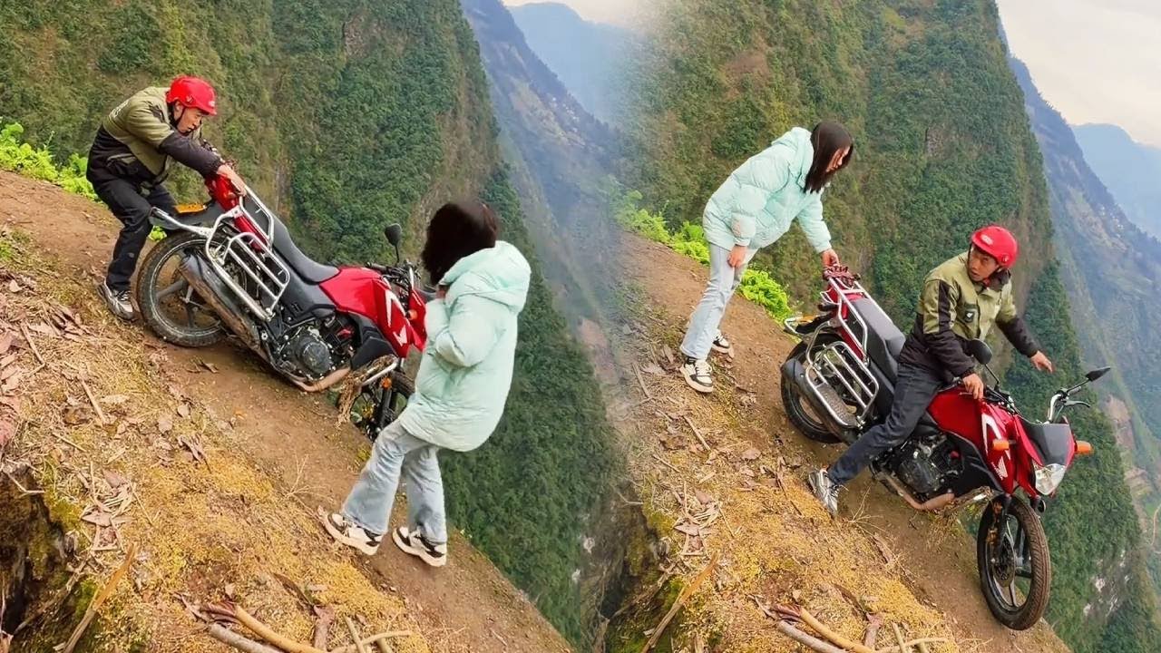 小伙骑摩托车竟然差点掉下悬崖！幸好看路过一个善良的美女，帮助他把摩托车拉了回来！