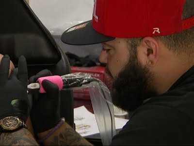 People Wait Hours for 'One Pulse' Tattoos