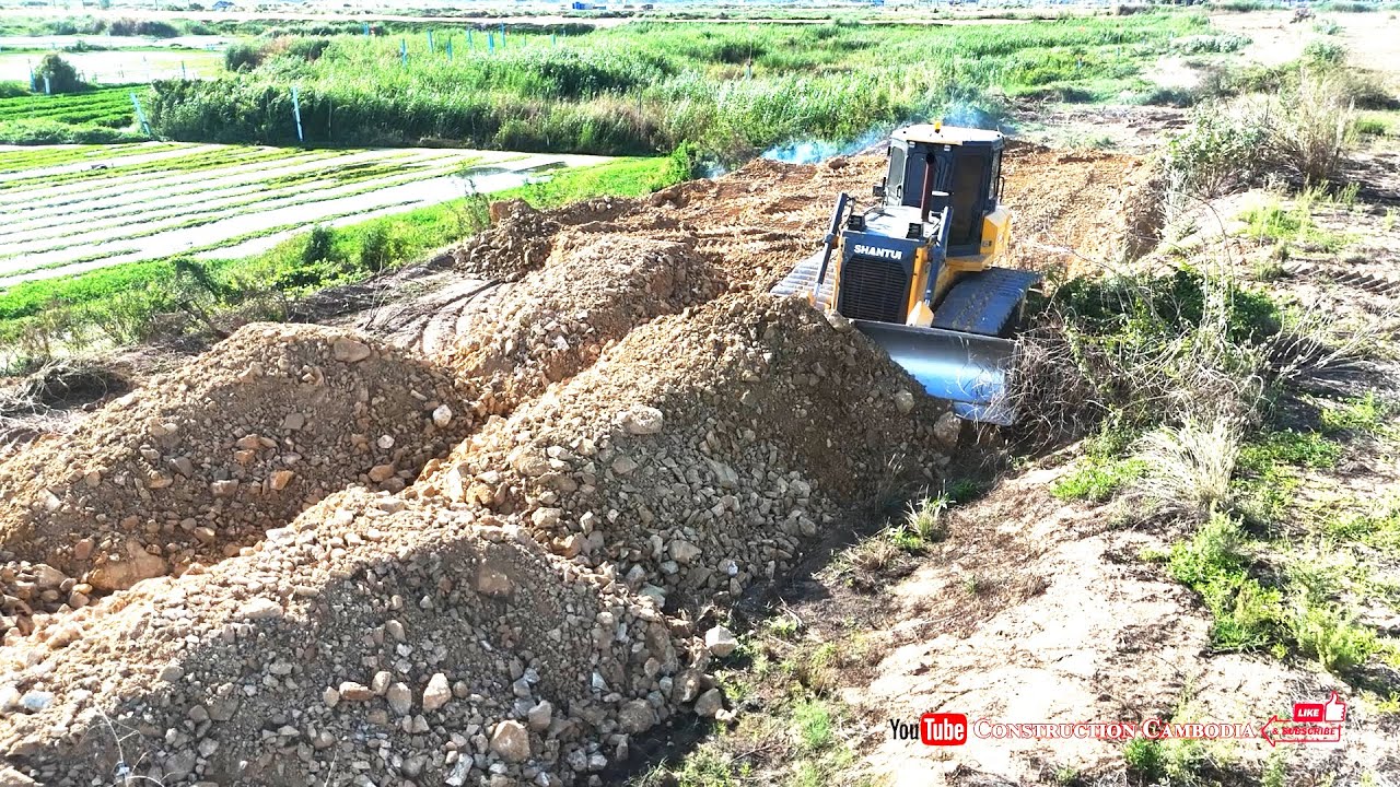 Powerful Bulldozer Pushing Soil And Dump Trucks Filling Up Land Fast