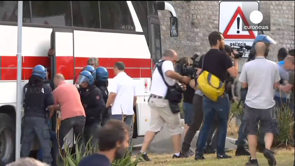 Dramatic scences as stranded African migrants flee Italy police
