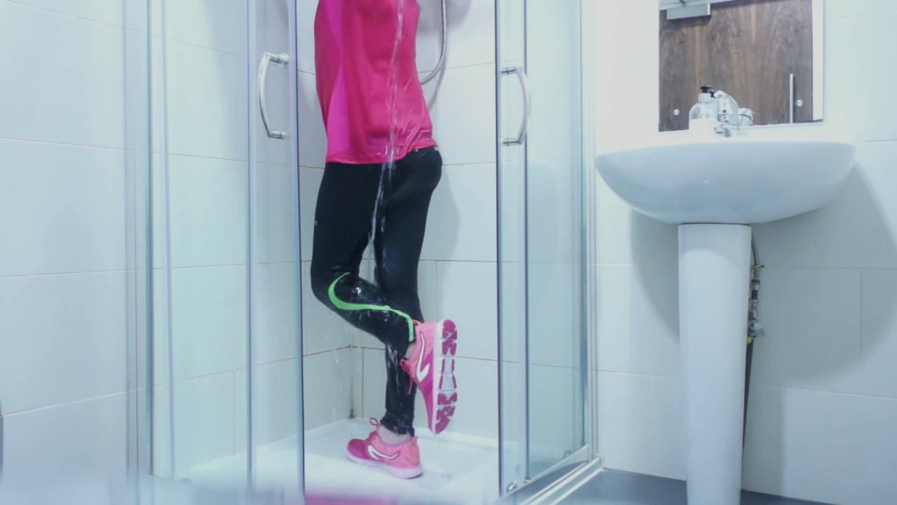 Sneakers and leggings and jogging t-shirt in the shower