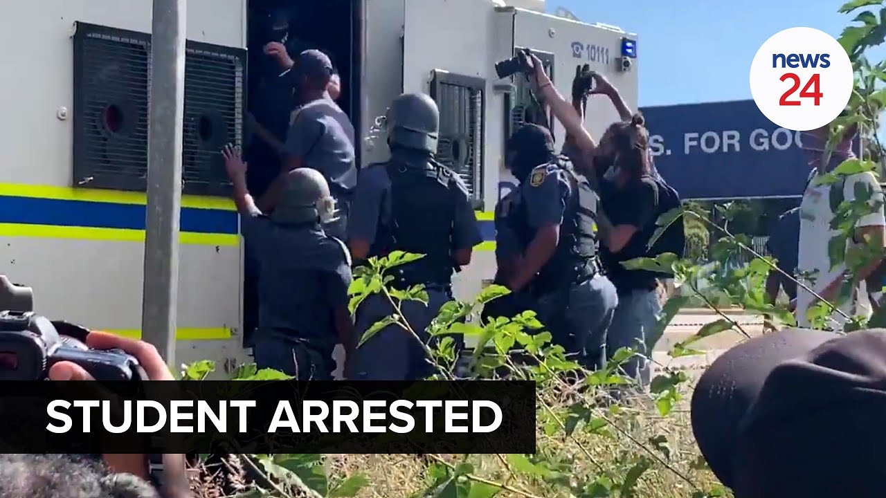 WATCH | Police arrest Wits student as protesters barricade Joburg main road