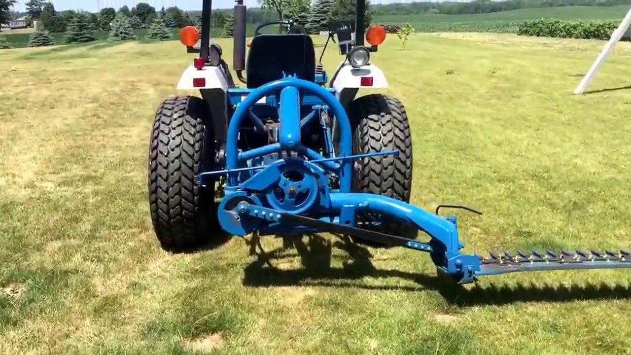 Ford 501 seven foot 3pt sickle mower mounted on Ford New Holland 1720