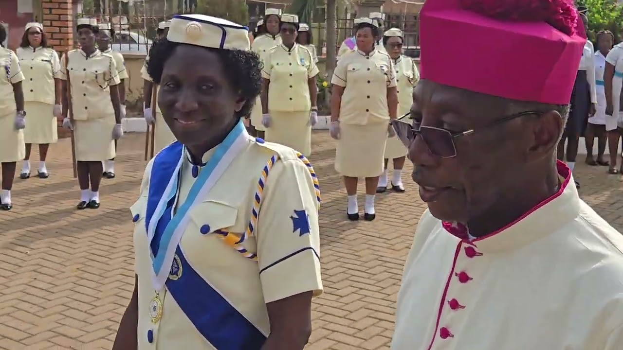 Rev. Msgr. James Robert Myers inspects the Guard of Honour 