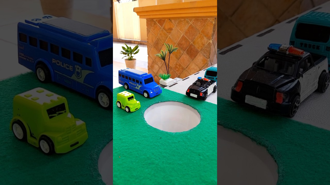 Monster car pushing black police car in pit