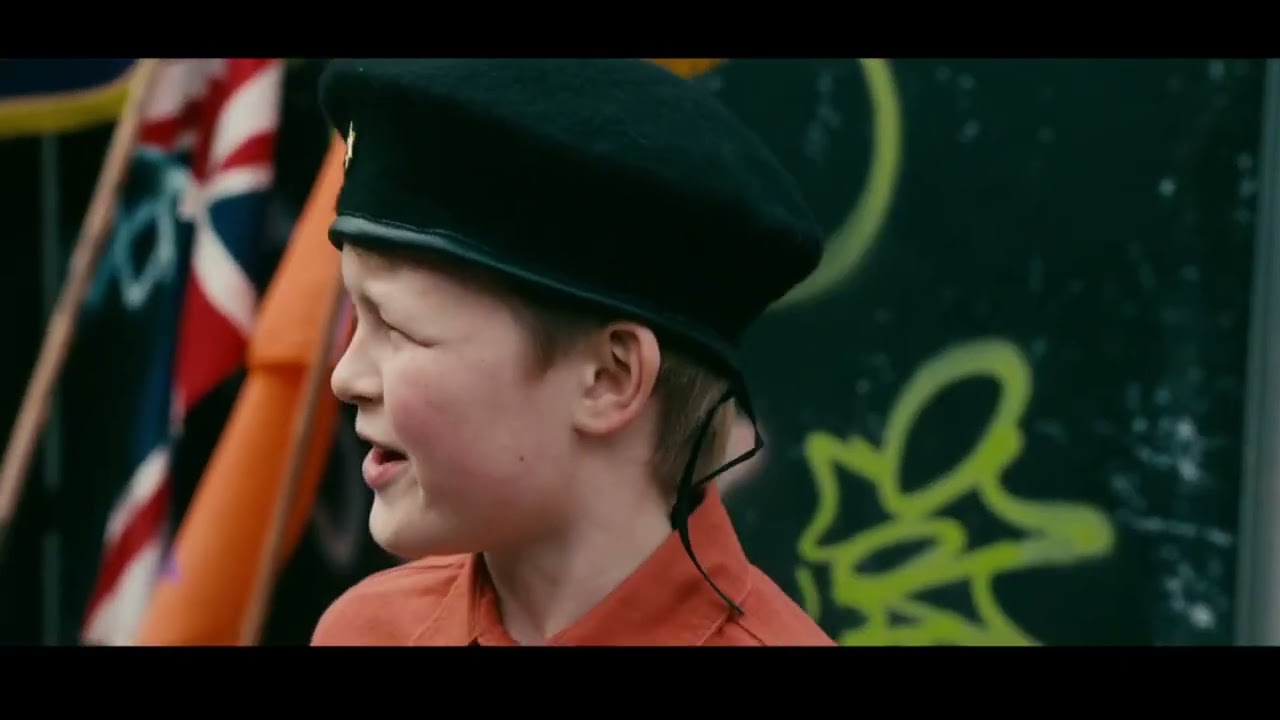 KNEECAP Orange Walk Scene