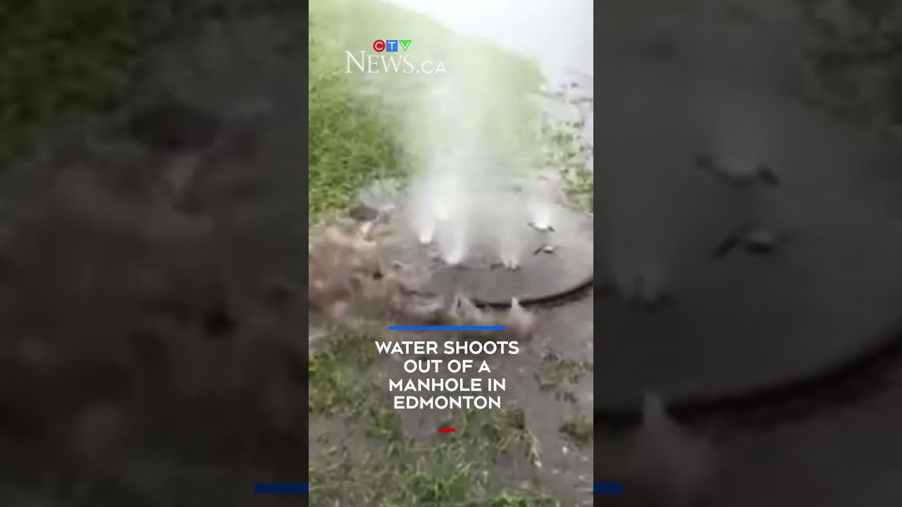 Water shoots out of Edmonton manhole cover