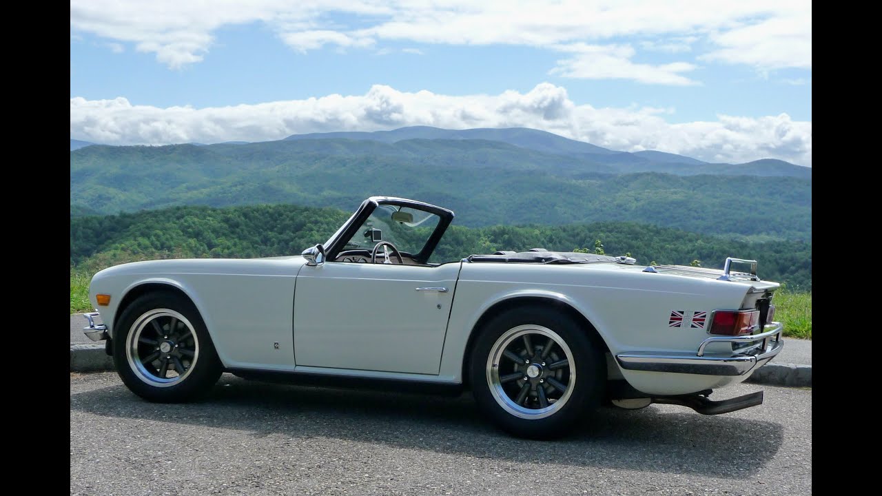 Triumph TR6 1973 года, как снять карбюраторы Zenith Stromberg, впускной и выпускной коллекторы