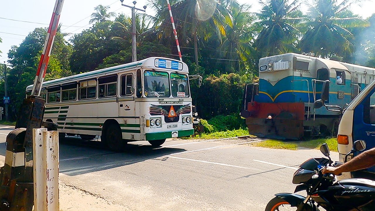 Very Fast SCHOOL BUS stuck ON railroad crossing Srilanka ( Double Engine Train)