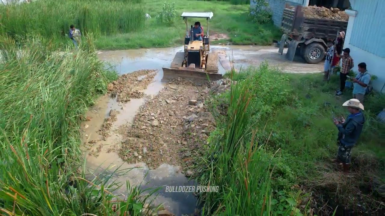 First Start a New Project! Landfill Flooded Pond By Dozer Komat'su D20P & 5Ton Truck Pushing Stone