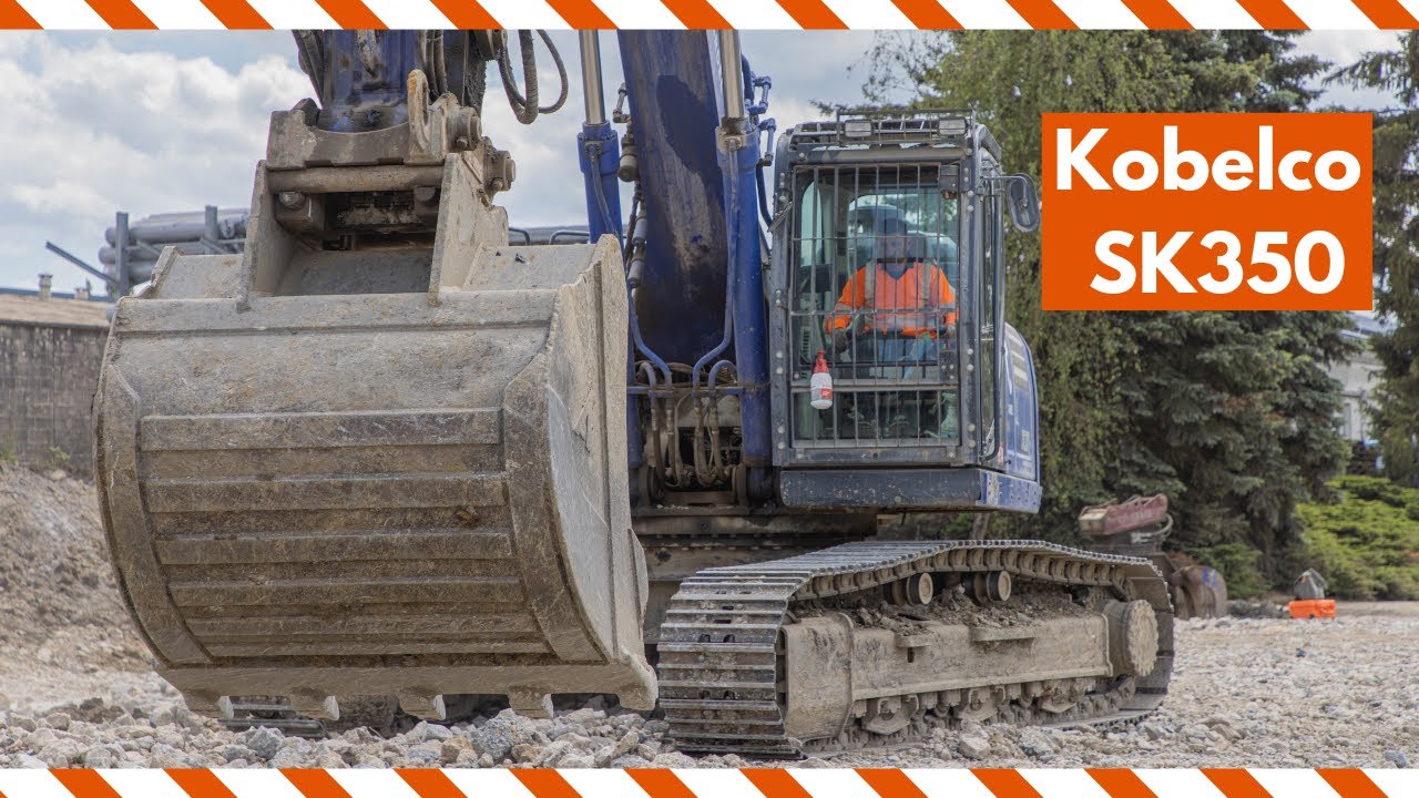 Kobelco SK350 grading and leveling rough stone