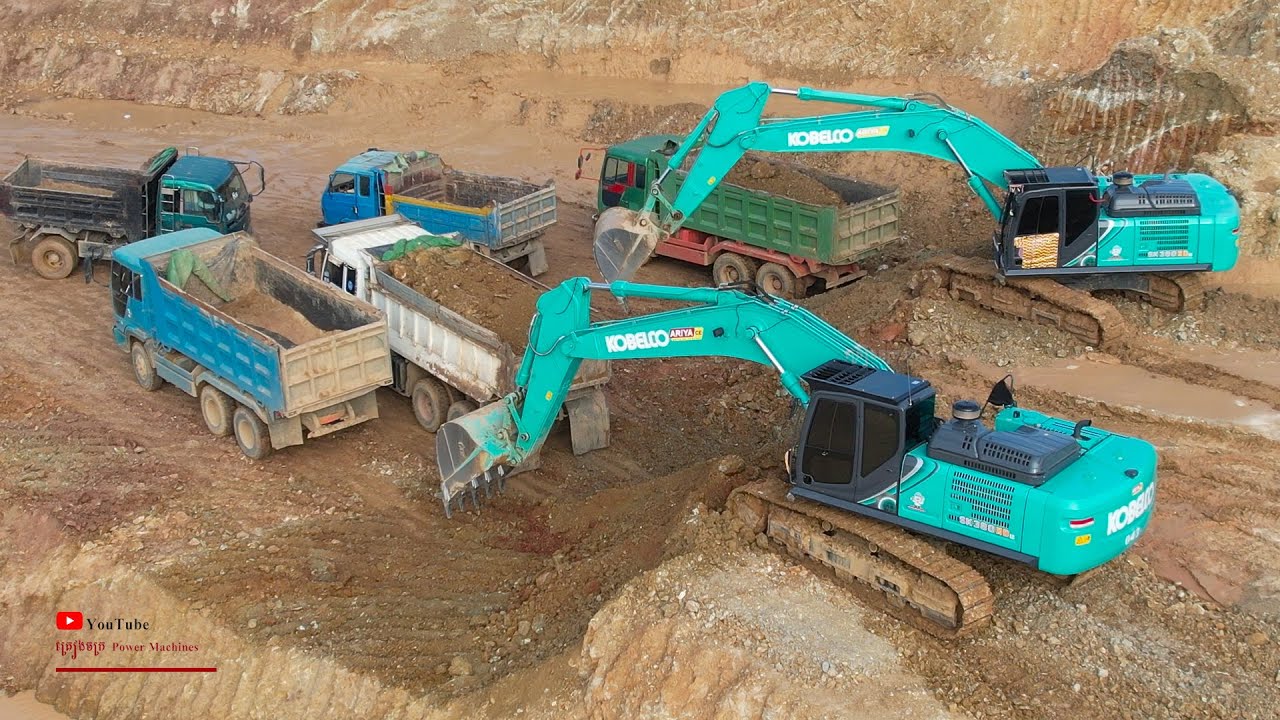 Big Kobelco Excavator Moving Soils Heavy Power Loading On Dump Truck