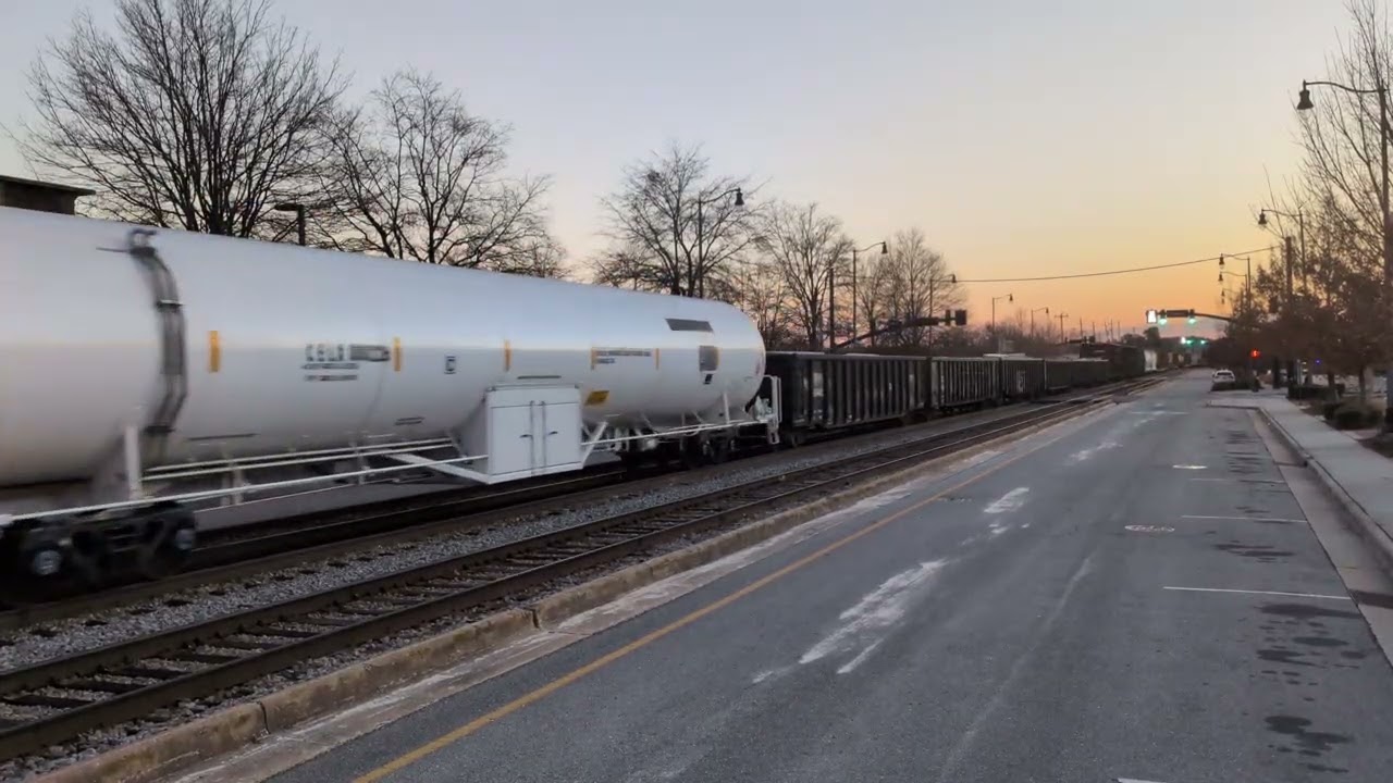 CSX 929 and CSX 747 lead a north bound mixed freight train by the Fayetteville City Police station 