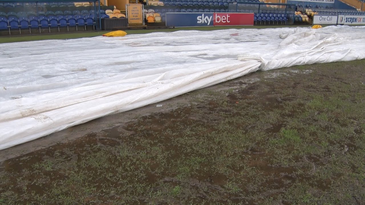 Referee and groundsman on Swindon postponement