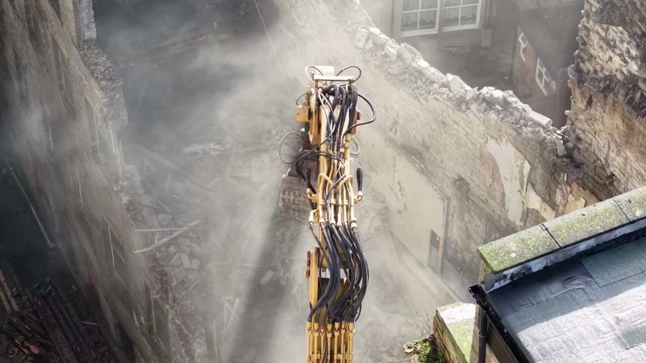 Caterpillar 345 high reach demolition excavator on Dale Street Bradford